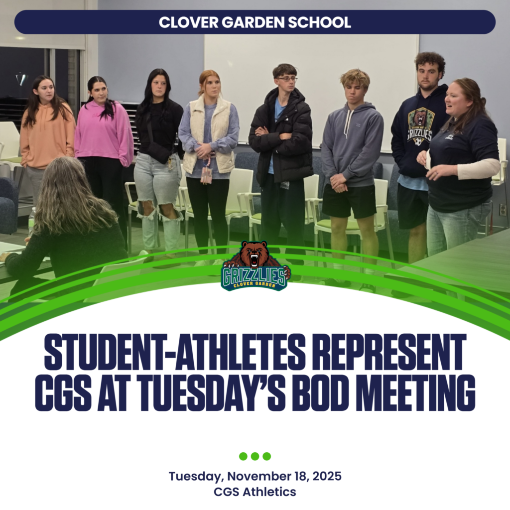 A group of Clover Garden School student-athletes stand at the front of a meeting room as a coach speaks to the Board of Directors.