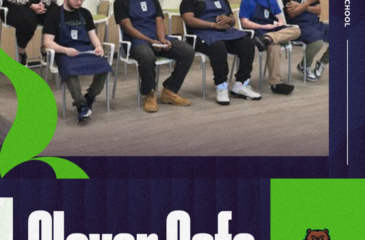 Six students wearing blue aprons sit in a row of chairs inside the Clover Café at Clover Garden High School while presenting during a board meeting, with a staff member seated nearby. The Clover Café and Grizzlies logos appear in the graphic design of the slide.