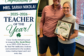 Mrs. Sarah Nikola smiles while holding her 2025–2026 CGS Teacher of the Year award.