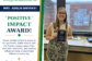 Mrs. Adelin Brooks smiles while holding her CGS Positive Impact Award.
