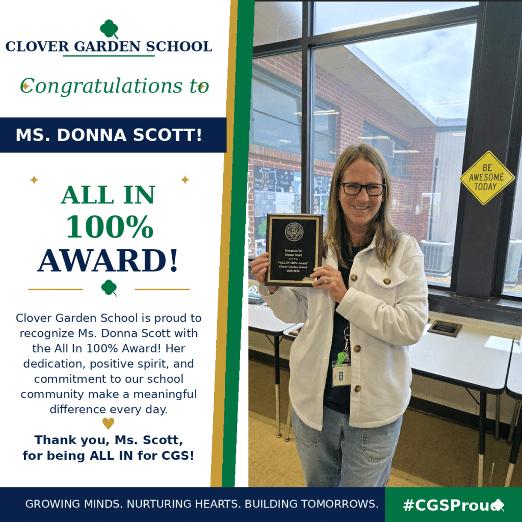Ms. Donna Scott smiles while holding her CGS All In 100% Award.