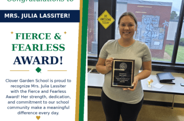 Mrs. Julia Lassiter smiles while holding her CGS Fierce and Fearless Award.