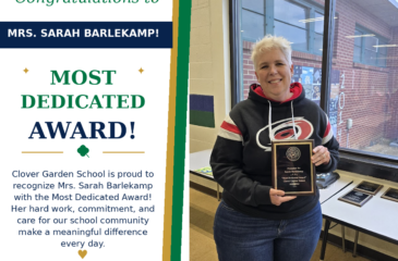 Mrs. Sarah Barlekamp smiles while holding her CGS Most Dedicated Award.