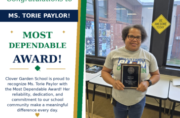 Ms. Torie Paylor smiles while holding her CGS Most Dependable Award.