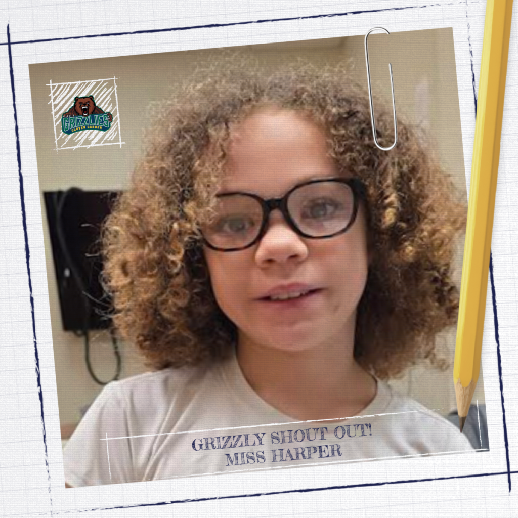 Close-up of a student with curly hair and glasses in a classroom setting, featured in a Grizzly Shoutout graphic labeled “Miss Harper,” with Clover Garden School branding.